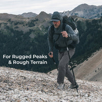 man hiking up steep, rocky terrain while wearing gray hiking pants