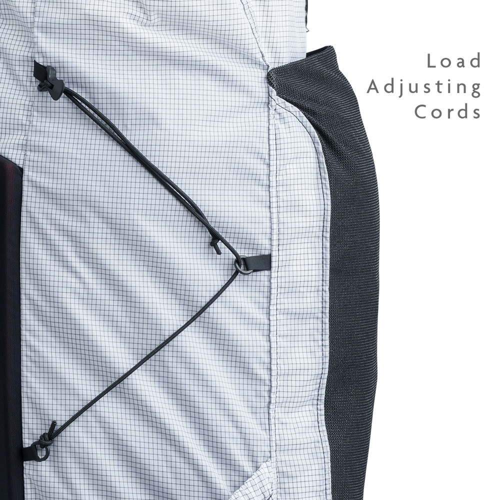 Close-up of backpack side panel showing adjustable load-compression cords.