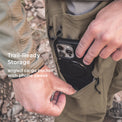man puts phone in angled pants cargo pocket with a built-in phone sleeve