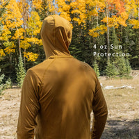 Golden - rear view of hiker wearing sun shirt (hood up) during autumn