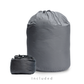 Two gray storage bags for a backpacking quilt: a large drawstring long-term storage sack and a smaller compressible stuff sack.