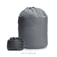 Two gray storage bags for a backpacking quilt: a large drawstring long-term storage sack and a smaller compressible stuff sack.