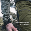 close view of man unzipping side vent on lightweight pants for mountain activity