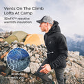 A man wearing a black 3DeFX hooded jacket and a gray cap stands on a rocky mountainside with tents in the background. Text reads 'Vents On The Climb Lofts At Camp' and '3DeFX™ reactive warmth insulation,' with a circular inset showing the fabric's stretch pattern.