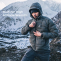 man wearing warm puffy down jacket in high mountain conditions