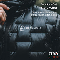 A close-up of a black puffer jacket worn by a person, with a hand adjusting the collar. The jacket has a visible 'OUTDOOR VITALS' logo on the chest and promotional text in the upper right about ZeroStitch fabric.