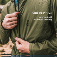 Close-up of a person wearing an olive green lightweight jacket and pulling the zipper with both hands. White text on the right reads 'YKK 1/4 Zipper easy on & off increased venting'.