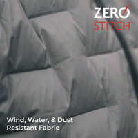 Close-up of a gray quilted fabric surface with padded sections and overlaid text reading 'Wind, Water, & Dust Resistant Fabric' and a 'ZERO STITCH' logo in the top right.