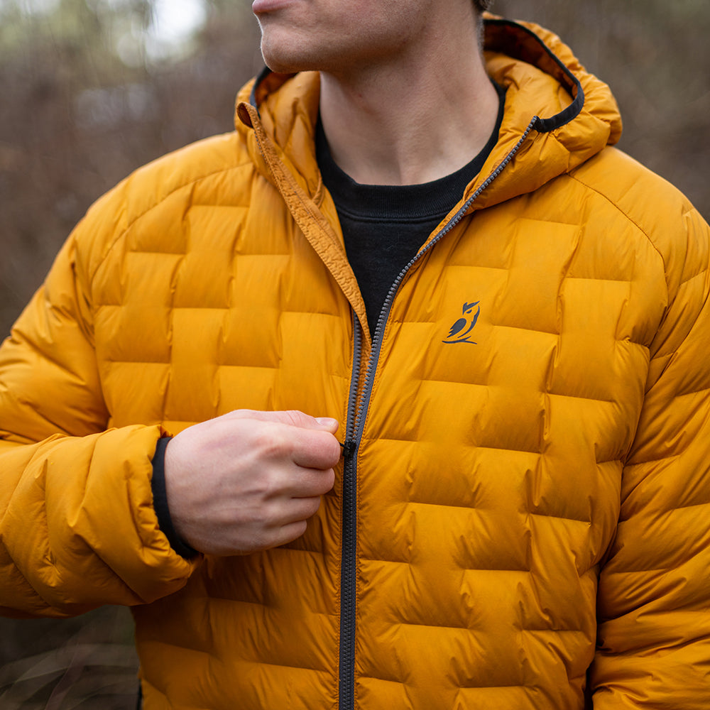 Close-up of men’s insulated down jacket showing front zipper and hooded collar.