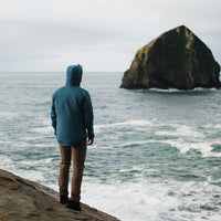 man wearing Ventus Active Hoodie on pacific northwest coast