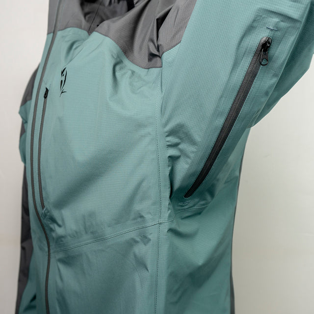 Close-up view of the zippered armpit vent of the ultralight rain jacket