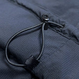 close view of hem adjustment cord on men's active mid layer hoodie for backpacking