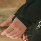 close view of thumb loop on windbreaker jacket sleeve