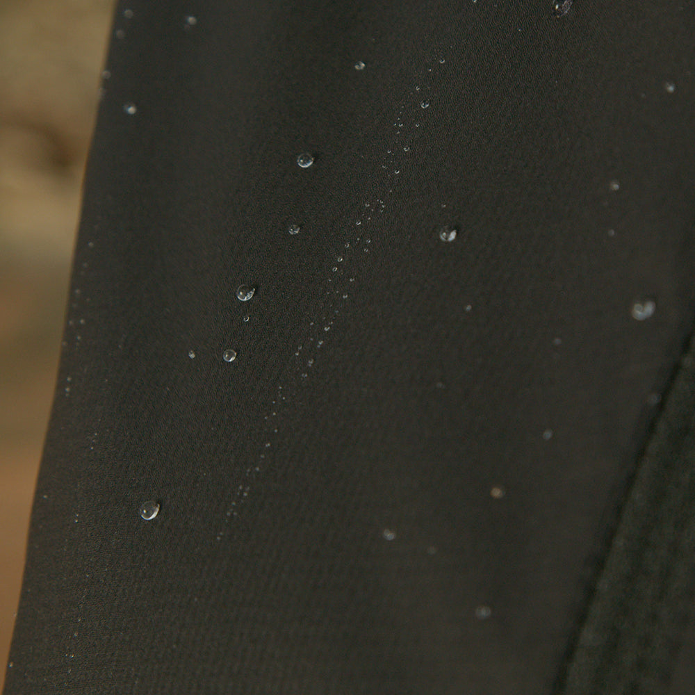 close view of water beading up on DWR treated windbreaker jacket fabric