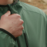 close view of front zipper & zippered chest pocket on windbreaker jacket