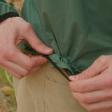 close view of hem adjustment on windbreaker jacket