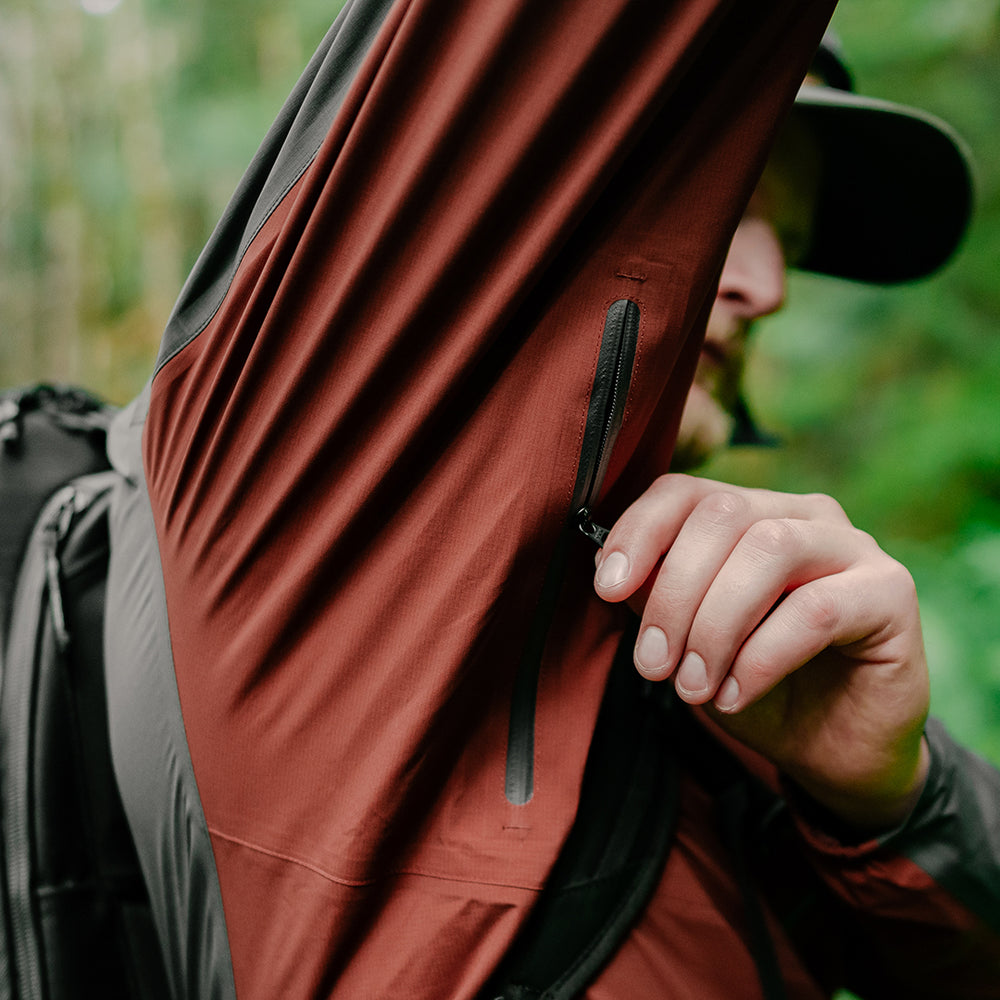 close view of underarm zipper vents on men's ultralight rain jacket