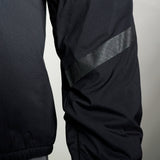 close view of reflective fabric strip on men's black active mid layer jacket for hiking