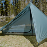 front view of trekking pole tent with large vestibule open to show zippered door